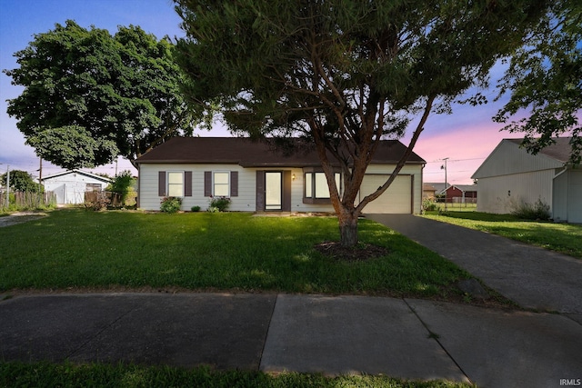 415 Grapevine Ln, Fort Wayne, IN 46825 - ranch-style home featuring driveway, a front lawn, and an attached garage