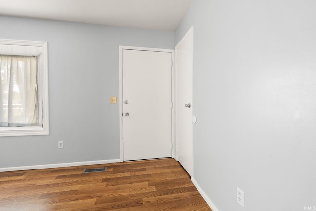 415 Grapevine Ln, Fort Wayne, IN 46825 - empty room with wood finished floors and baseboards