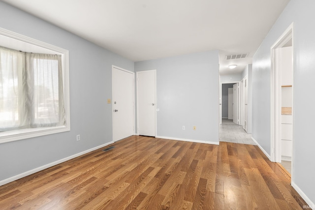 415 Grapevine Ln, Fort Wayne, IN 46825 - spare room with light wood-style floors and baseboards