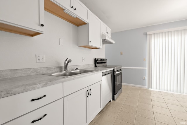 415 Grapevine Ln, Fort Wayne, IN 46825 - kitchen with appliances with stainless steel finishes, light countertops, under cabinet range hood, white cabinets, and light tile patterned floors