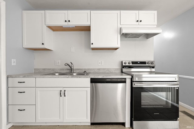 415 Grapevine Ln, Fort Wayne, IN 46825 - kitchen featuring stainless steel appliances, range hood, white cabinets, and light countertops
