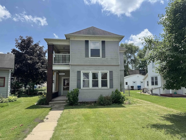 325 W Linden Ave, Logansport, IN 46947 - view of front of home featuring a balcony and a front lawn