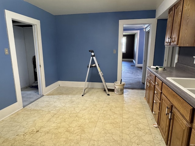 325 W Linden Ave, Logansport, IN 46947 - kitchen with dark countertops and baseboards