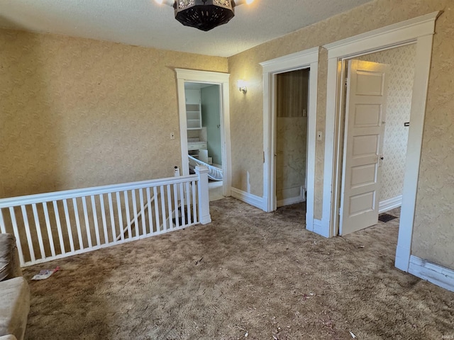 325 W Linden Ave, Logansport, IN 46947 - spare room with wallpapered walls and carpet