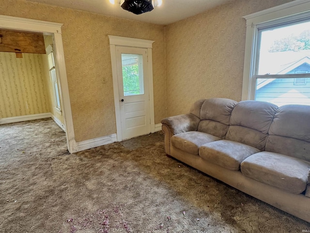 325 W Linden Ave, Logansport, IN 46947 - carpeted living room with plenty of natural light and wallpapered walls