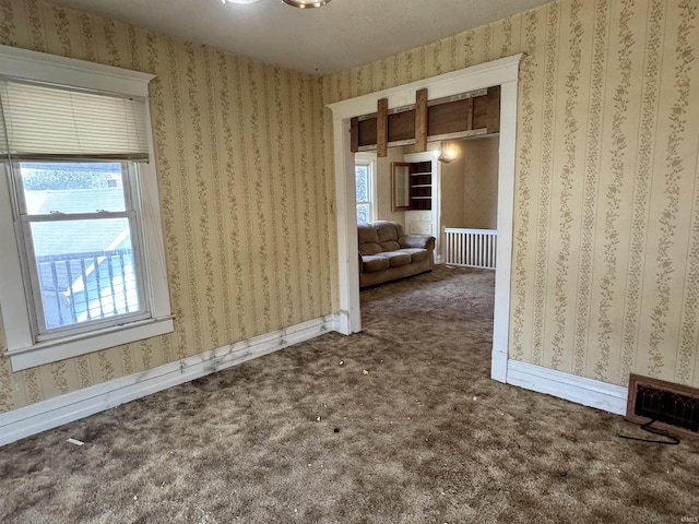 325 W Linden Ave, Logansport, IN 46947 - unfurnished room featuring carpet floors and wallpapered walls