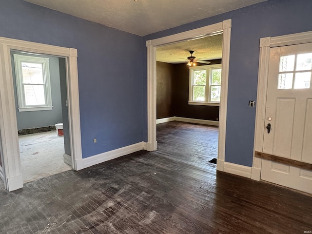 325 W Linden Ave, Logansport, IN 46947 - entryway featuring ceiling fan, a textured ceiling, and wood finished floors