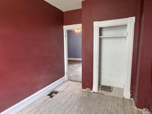 325 W Linden Ave, Logansport, IN 46947 - unfurnished bedroom featuring wood-type flooring and a closet