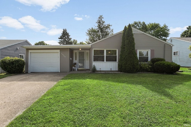 4026 Brookton Dr, South Bend, IN 46614 - view of front of home with an attached garage, concrete driveway, and a front lawn