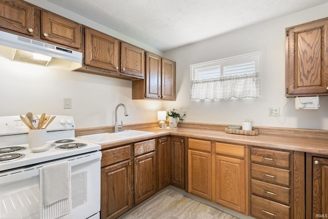 4026 Brookton Dr, South Bend, IN 46614 - kitchen featuring white electric stove, under cabinet range hood, brown cabinets, and light countertops