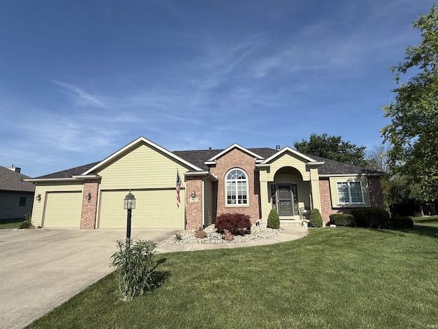 9825 Tamar Trl, Fort Wayne, IN 46825 - single story home featuring brick siding, a front lawn, concrete driveway, and a garage
