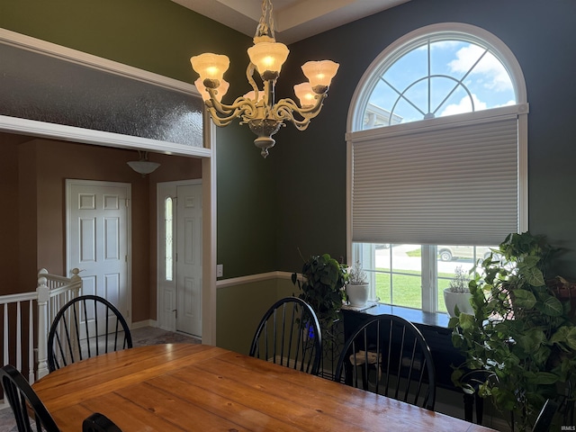 9825 Tamar Trl, Fort Wayne, IN 46825 - dining area with a chandelier and healthy amount of natural light