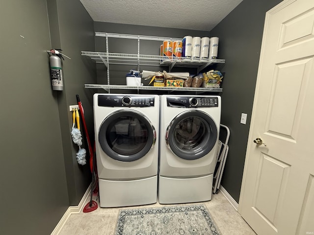 9825 Tamar Trl, Fort Wayne, IN 46825 - washroom with washing machine and dryer and a textured ceiling