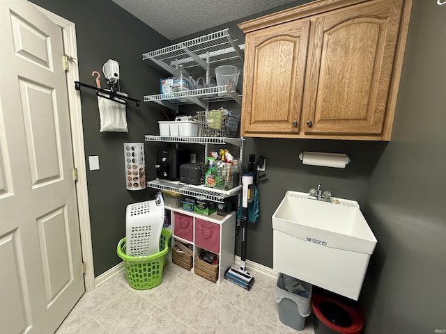 9825 Tamar Trl, Fort Wayne, IN 46825 - washroom with light tile patterned floors and a textured ceiling