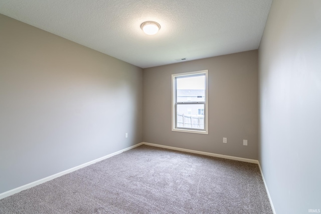 3827 Winter Raven Trl, Fort Wayne, IN 46818 - carpeted empty room with baseboards and a textured ceiling