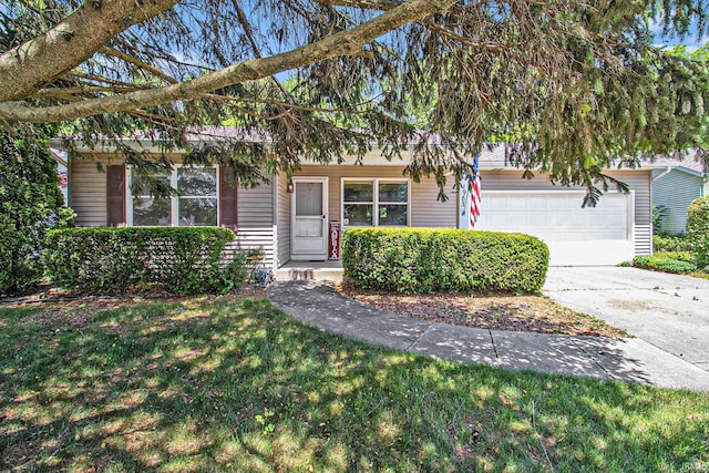 1983 Greenock St, South Bend, IN 46614 - view of front of home with an attached garage, driveway, and a front yard