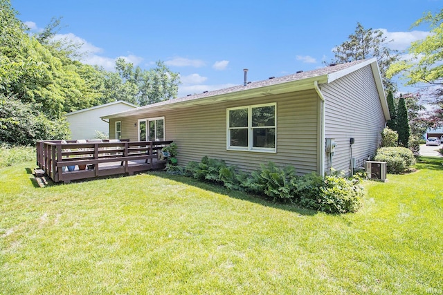 1983 Greenock St, South Bend, IN 46614 - back of property with a wooden deck and a yard