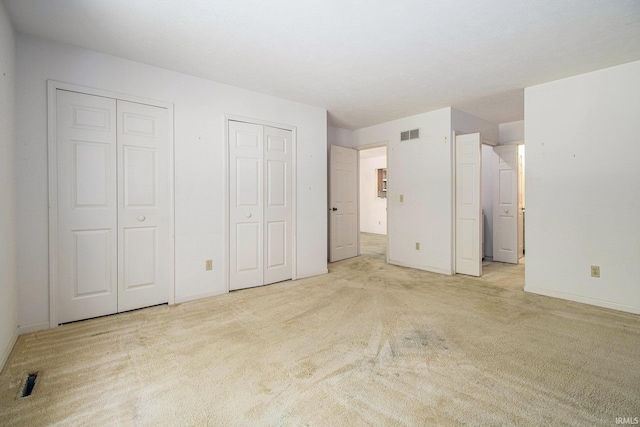 1983 Greenock St, South Bend, IN 46614 - unfurnished bedroom featuring two closets and carpet floors