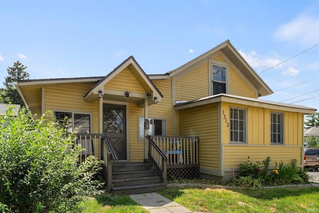1313 Tecumseh St, Fort Wayne, IN 46805 - view of front facade with board and batten siding and a wooden deck