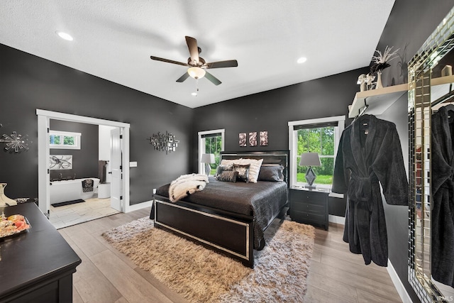 1229 Corby Blvd, South Bend, IN 46617 - bedroom with light wood-style floors, a ceiling fan, recessed lighting, and ensuite bathroom