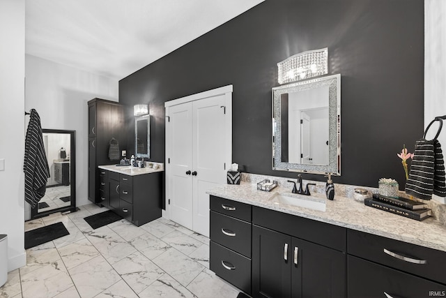 1229 Corby Blvd, South Bend, IN 46617 - bathroom featuring marble finish floors, two vanities, and a chandelier