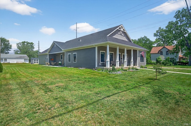 1229 Corby Blvd, South Bend, IN 46617 - rear view of property featuring covered porch and a lawn