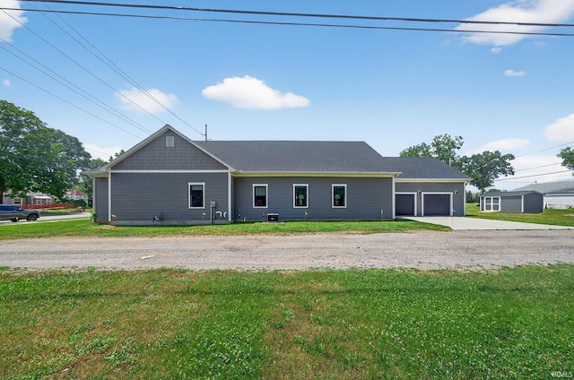 1229 Corby Blvd, South Bend, IN 46617 - ranch-style home featuring driveway, a garage, and a front yard
