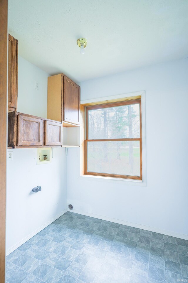 348 Arthur Rd, Springville, IN 47462 - laundry area featuring cabinet space and washer hookup