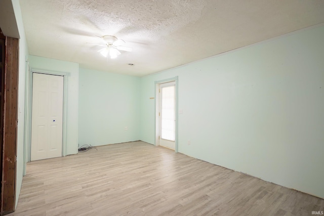 348 Arthur Rd, Springville, IN 47462 - unfurnished room with light wood-type flooring, a textured ceiling, and a ceiling fan