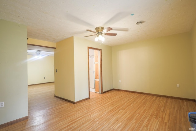 348 Arthur Rd, Springville, IN 47462 - unfurnished room with a ceiling fan, light wood finished floors, and a textured ceiling