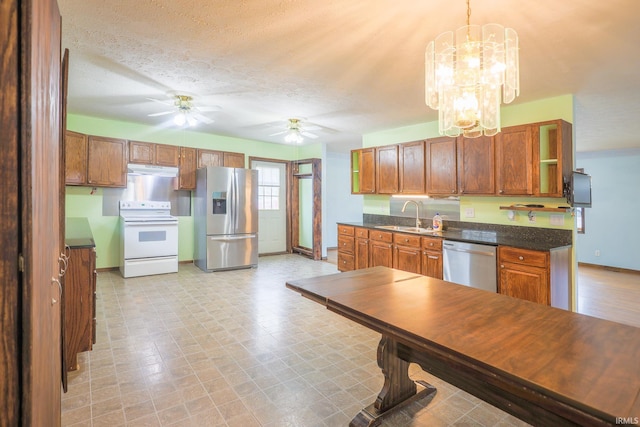 348 Arthur Rd, Springville, IN 47462 - kitchen with stainless steel appliances, ceiling fan, dark countertops, a chandelier, and light flooring