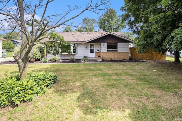 19545 Hildebrand St, South Bend, IN 46614 - single story home with brick siding, a chimney, and roof with shingles