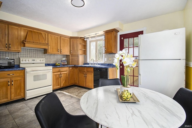 19545 Hildebrand St, South Bend, IN 46614 - kitchen featuring white appliances, custom exhaust hood, decorative backsplash, open shelves, and brown cabinetry
