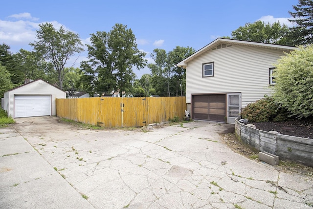 19545 Hildebrand St, South Bend, IN 46614 - view of side of home featuring a garage and an outdoor structure