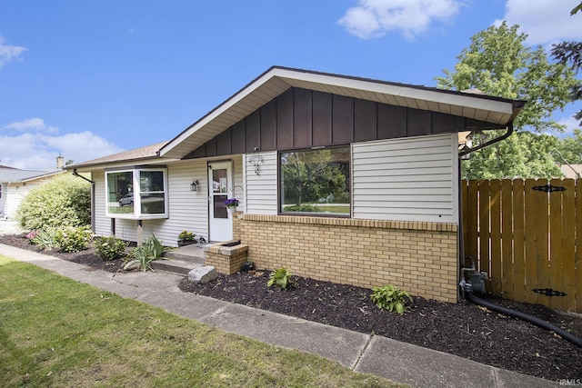 19545 Hildebrand St, South Bend, IN 46614 - view of front of home featuring brick siding and board and batten siding