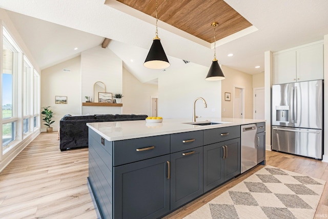 17882 Pavia Pass, Huntertown, IN 46748 - kitchen with appliances with stainless steel finishes, light wood-style flooring, light countertops, a kitchen island with sink, and recessed lighting