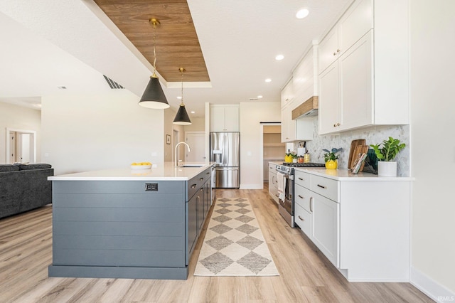 17882 Pavia Pass, Huntertown, IN 46748 - kitchen with appliances with stainless steel finishes, white cabinets, light wood-style floors, light countertops, and recessed lighting