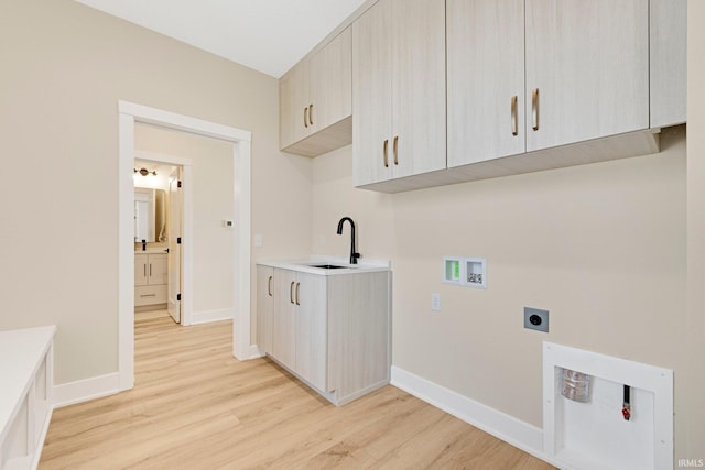 17882 Pavia Pass, Huntertown, IN 46748 - washroom with hookup for an electric dryer, light wood-type flooring, cabinet space, and hookup for a washing machine
