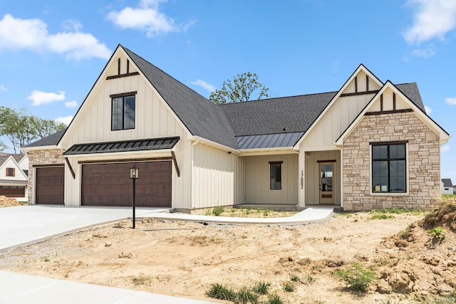 17882 Pavia Pass, Huntertown, IN 46748 - modern farmhouse with a standing seam roof, board and batten siding, stone siding, and driveway