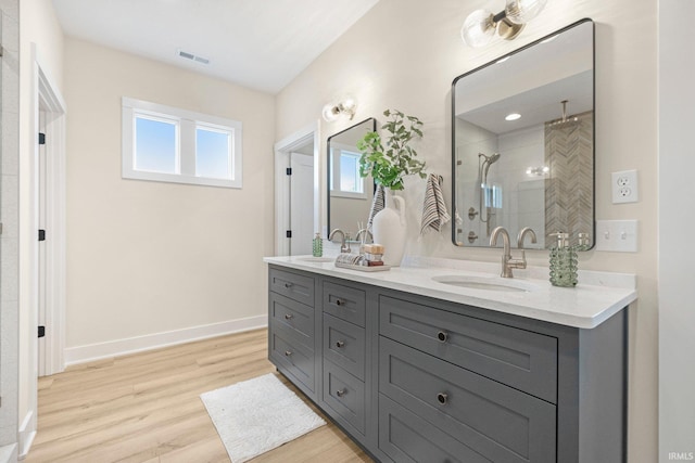 17882 Pavia Pass, Huntertown, IN 46748 - full bath featuring double vanity, wood finished floors, and a tile shower