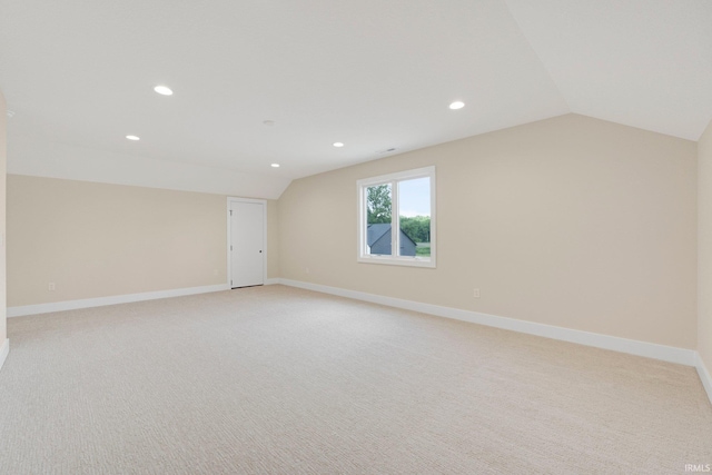 17882 Pavia Pass, Huntertown, IN 46748 - spare room with vaulted ceiling, recessed lighting, and light carpet