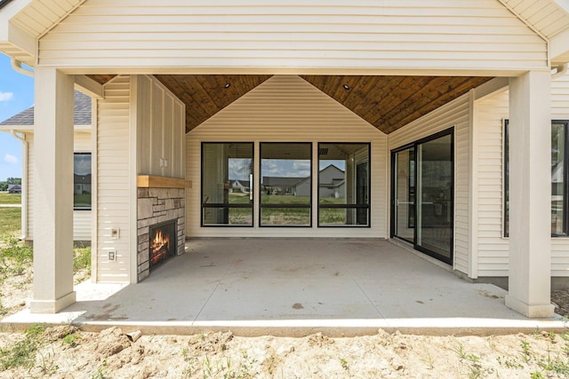 17882 Pavia Pass, Huntertown, IN 46748 - view of patio featuring an outdoor stone fireplace
