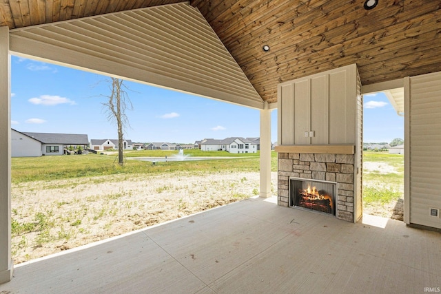 17882 Pavia Pass, Huntertown, IN 46748 - view of patio / terrace with an outdoor stone fireplace and a residential view