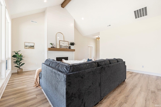 17882 Pavia Pass, Huntertown, IN 46748 - living room with light wood-style flooring, a large fireplace, high vaulted ceiling, beamed ceiling, and recessed lighting
