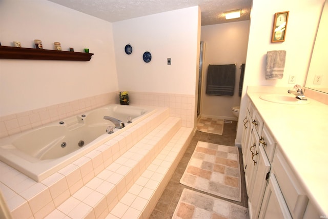 9841 S Harbour Pointe Dr, Bloomington, IN 47401 - full bathroom featuring a jetted tub, vanity, a shower stall, and a textured ceiling
