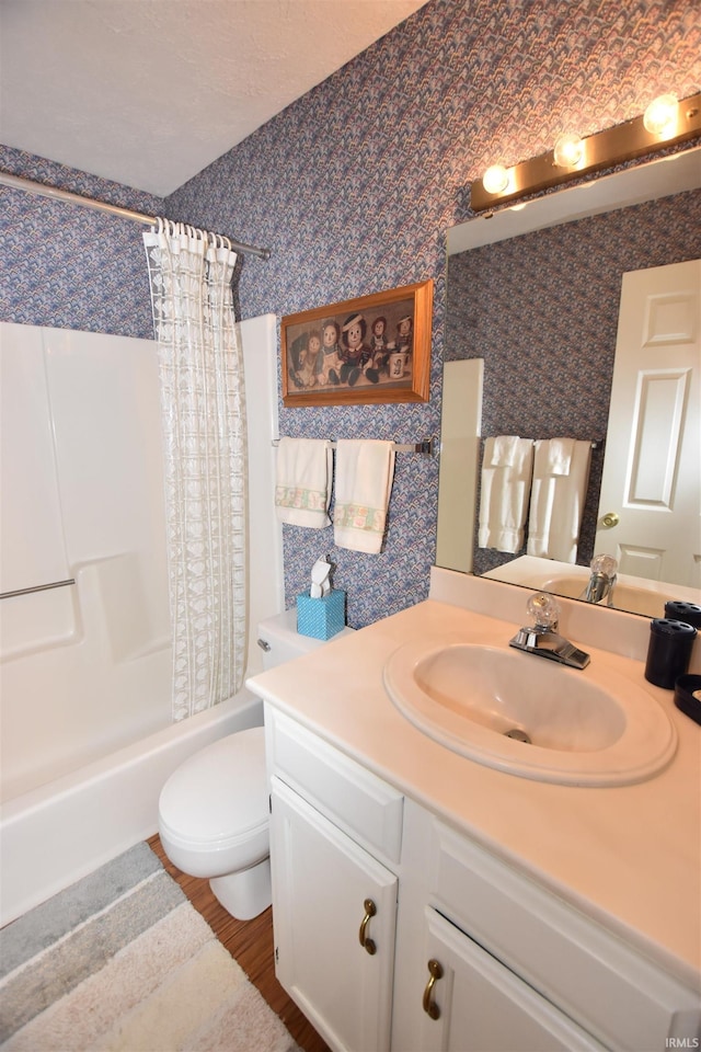 9841 S Harbour Pointe Dr, Bloomington, IN 47401 - bathroom featuring vanity, wallpapered walls, shower / bathtub combination with curtain, and wood finished floors
