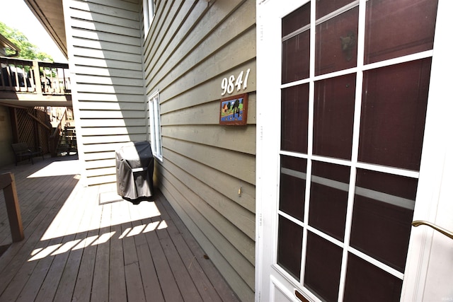 9841 S Harbour Pointe Dr, Bloomington, IN 47401 - wooden deck with stairway and a grill