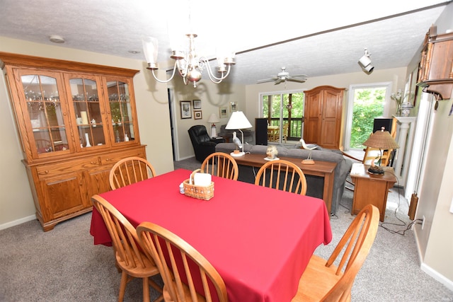 9841 S Harbour Pointe Dr, Bloomington, IN 47401 - dining area featuring a textured ceiling, a chandelier, light carpet, and a ceiling fan
