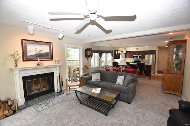 9841 S Harbour Pointe Dr, Bloomington, IN 47401 - living room with a ceiling fan, light colored carpet, a tile fireplace, and recessed lighting