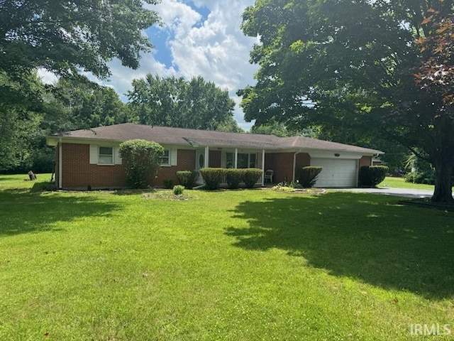803 Stanley St, Logansport, IN 46947 - single story home featuring a garage, a front lawn, and driveway